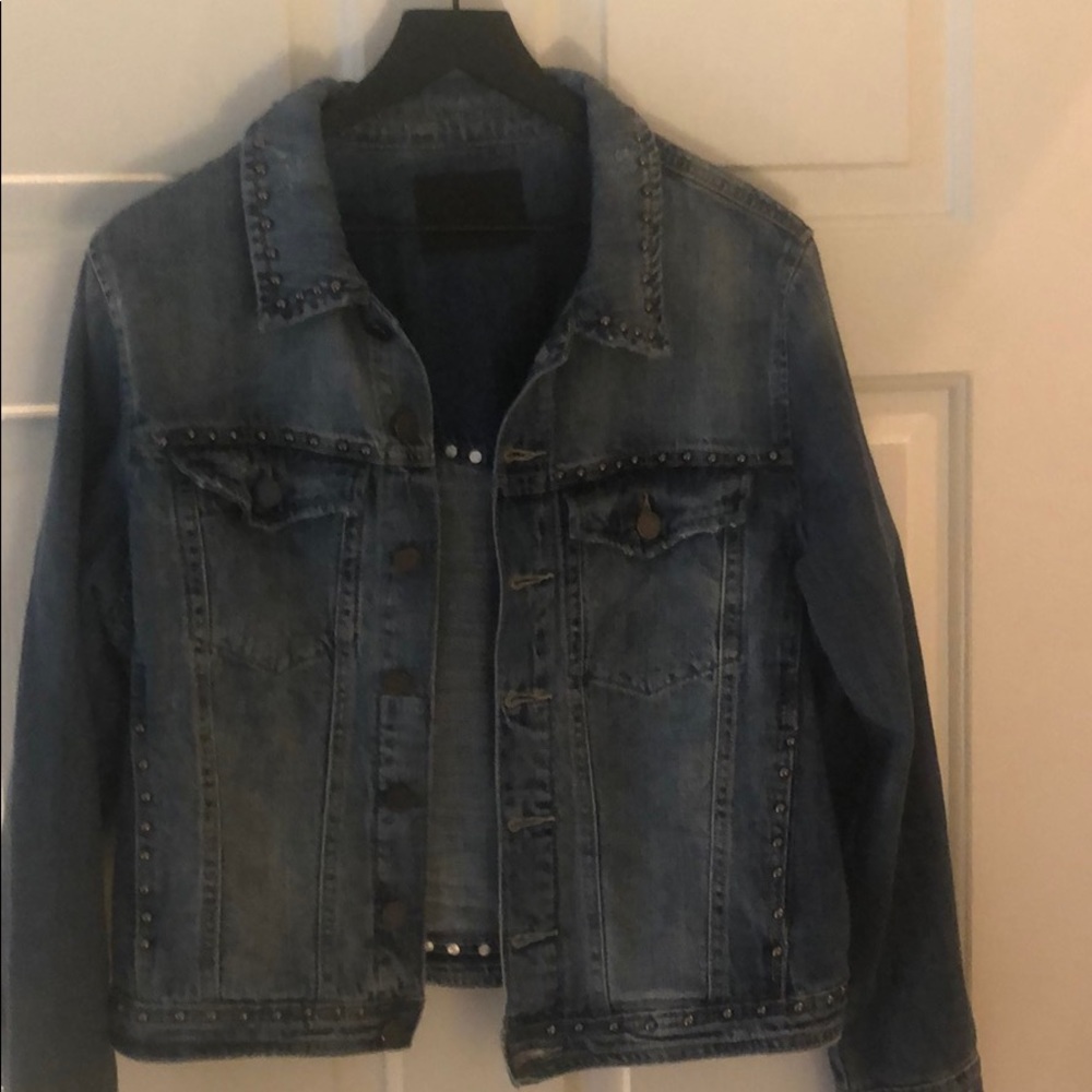Jean jacket with purposeful distress.